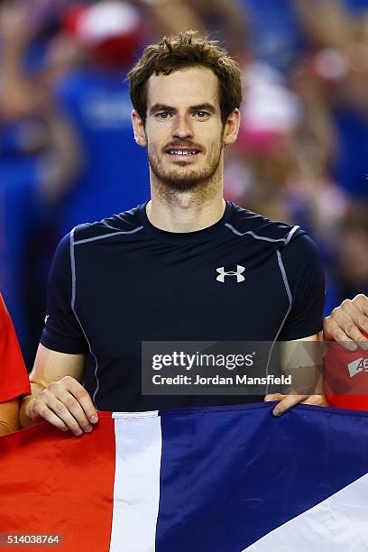 Andy Murray of Great Britain celebrates victory on day three of the Davis Cup World Group first round tie at the Barclaycard Arena on March 6, 2016...