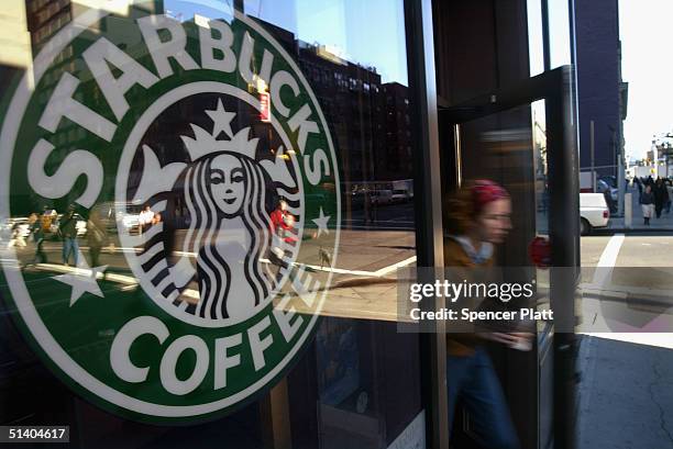 Person walks out of a Starbucks coffee shop October 5, 2004 in New York City. As coffee bean costs in the US have risen in the past two months, the...