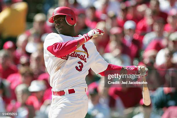 Edgar Renteria of the St. Louis Cardinals hits a two run double against the Los Angeles Dodgers in Game one of National League Division Series during...