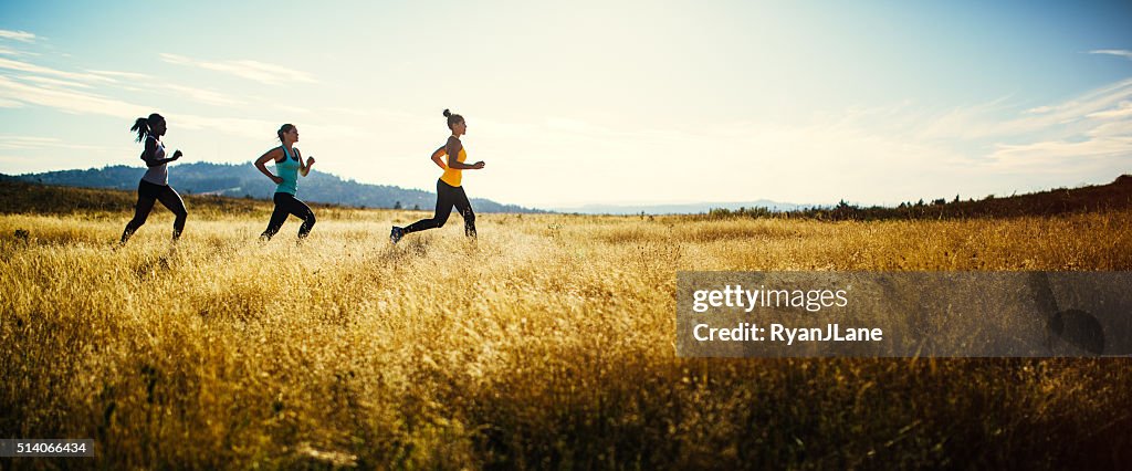 Group of Women Running in Nature Area