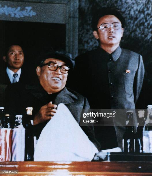 File photo released by the Korea News Service dated October 1980 shows North Korean leader Kim Jong-Il and father Kim Il-Sung , attending an evening...