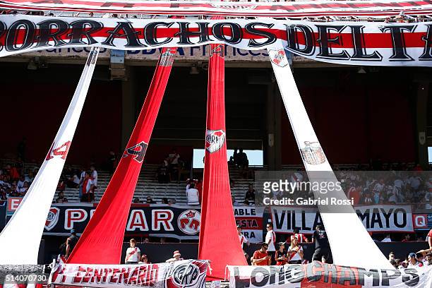 Fans of River Plate display flags during a match between River Plate and Boca Juniors as part of sixth round of Torneo Transicion 2016 at Monumental...