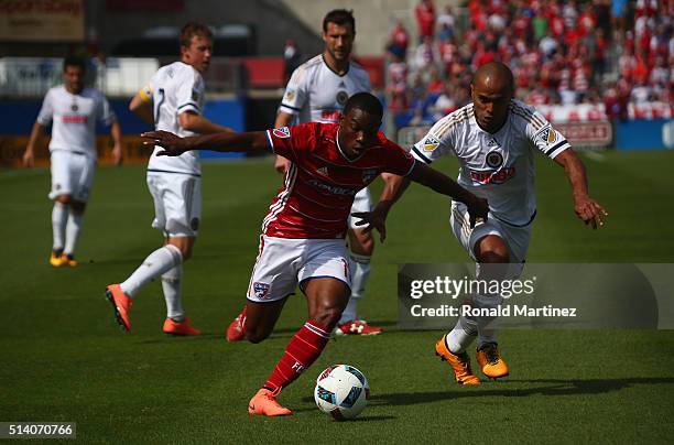 Fabian Castillo of FC Dallas dribbles the ball against Fabinho of Philadelphia Union in the first half during the MLS opening game at Toyota Stadium...