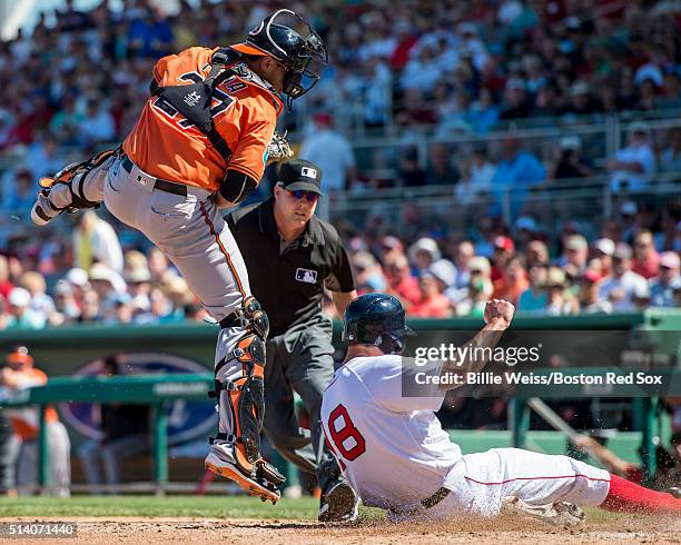 David Murphy of the Boston Red Sox scores during a Grapefruit League game against the Baltimore Orioles on March 6, 2016 at JetBlue Park at Fenway...