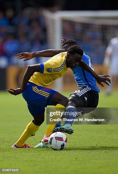 Dominique Badji of Colorado Rapids gets tripped by Simon Dawkins of San Jose Earthquakes during their MLS Soccer game in the first half at Avaya...