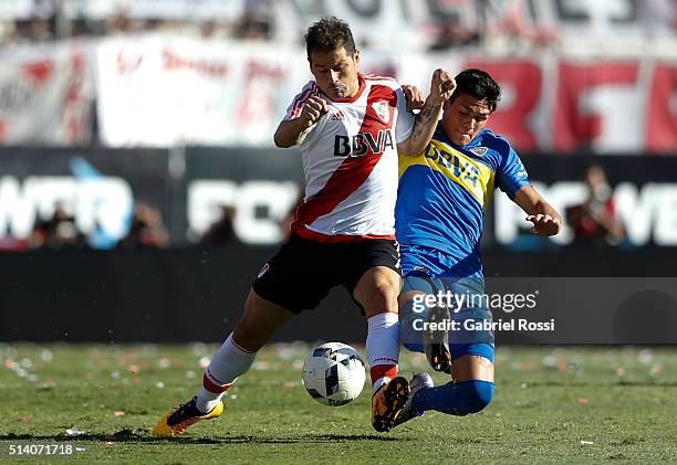 Rodrigo Mora of River Plate fights for the ball with Jonathan Silva of Boca Juniors during a match between River Plate and Boca Juniors as part of...