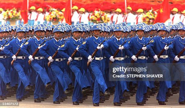 Soldiers in Beijing's civilian militia goose-step with their bayonettes as they pass Chinese President Jiang Zemin on Tiananmen Square's rostrum...