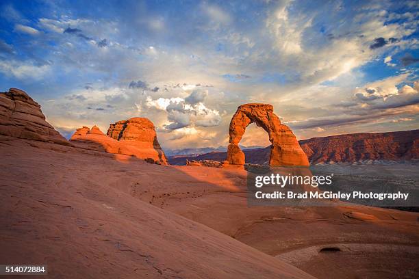 delicate arch sunlit - delicate arch stock pictures, royalty-free photos & images