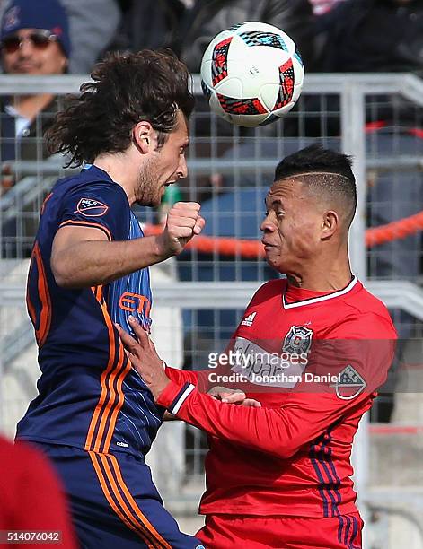 Mikkel Diskerud of New York City FC hads the ball over Rodrigo Ramos of Chicago Fire at Toyota Park on March 6, 2016 in Bridgeview, Illinois. The New...