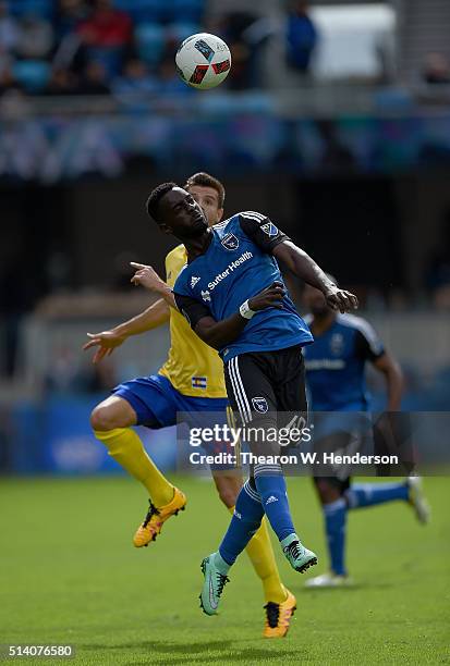 Simon Dawkins of San Jose Earthquakes battles for a header with Luis Solignac of Colorado Rapids during their MLS Soccer game in the second half at...