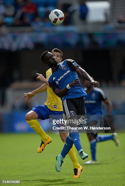 Simon Dawkins of San Jose Earthquakes battles for a header with Luis Solignac of Colorado Rapids during their MLS Soccer game in the second half at...