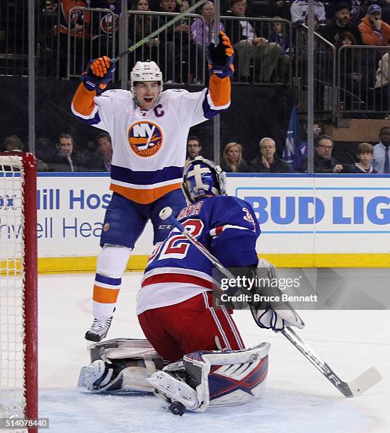 John Tavares of the New York Islanders celebrates a first period goal by Johnny Boychuk against Antti Raanta of the New York Rangers at Madison...