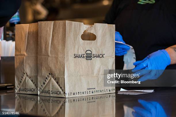 An order sits ready at a Shake Shack Inc. Restaurant in Bridgewater, New Jersey, U.S., on Friday, March 4, 2016. Shake Shack Inc. Is scheduled to...