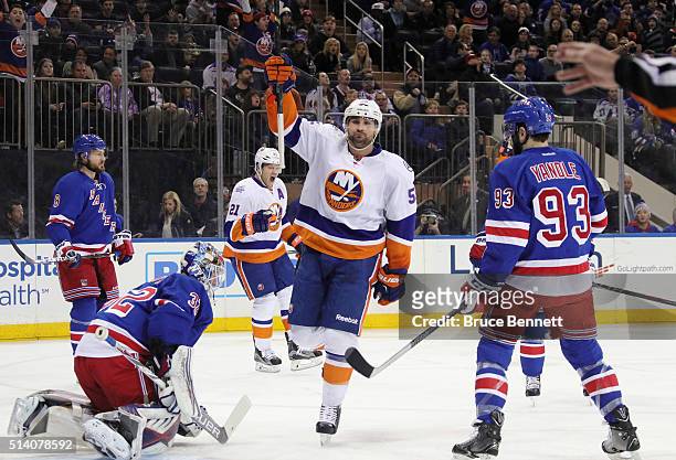 Johnny Boychuk of the New York Islanders celebrates his goal at 2:50 of the first period against Antti Raanta of the New York Rangers at Madison...
