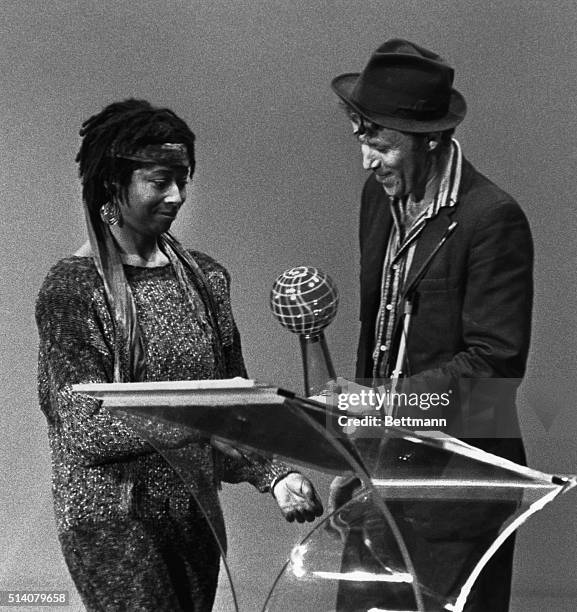 Pulitzer Prize winning American author, poet, and activist Alice Walker receives Purple Globe award from presenter Tom Waits here of Creative Arts in...