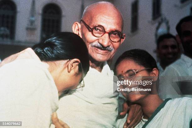 Mahatma Ghandi enjoys a laugh with his two granddaughters Ava and Manu at Birla House in New Delhi.