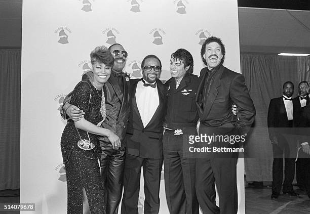Dionne Warwick, Stevie Wonder, Quincy Jones, Michael Jackson, and Lionel Richie congratualate each other after "We Are The World" won 4 Grammy Awards.