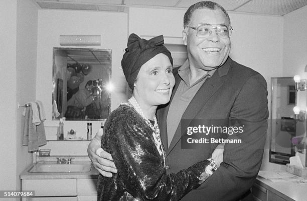 Singer Lena Horne hugs friend James Earl Jones backstage at the opening of "Fences" by playwright August Wilson.