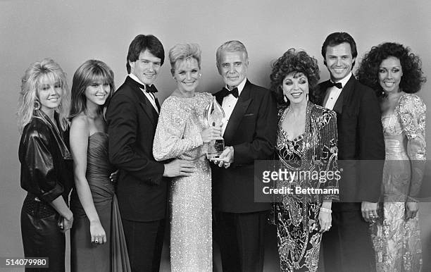 The cast of "Dynasty" gathers together on March 11 after winning the People's Choice Award, which they share with "Miami Vice". The group includes...