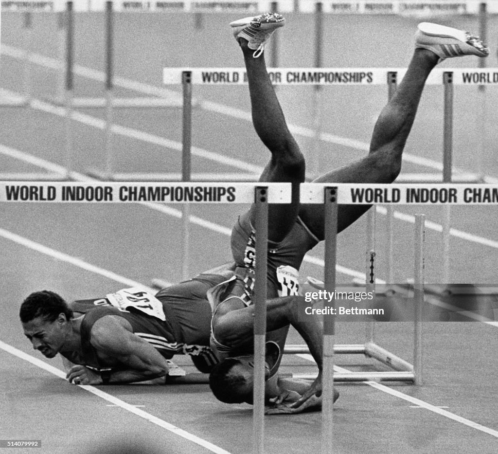 Runner Tumbles Headfirst Over Hurdles