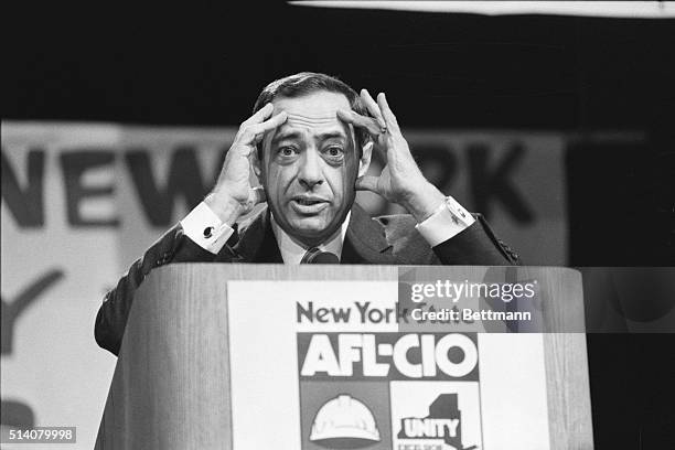 New York Governor Mario Cuomo displays a quizzical expression during an address to the state AFL-CIO convention in Albany; hands at sides of face....