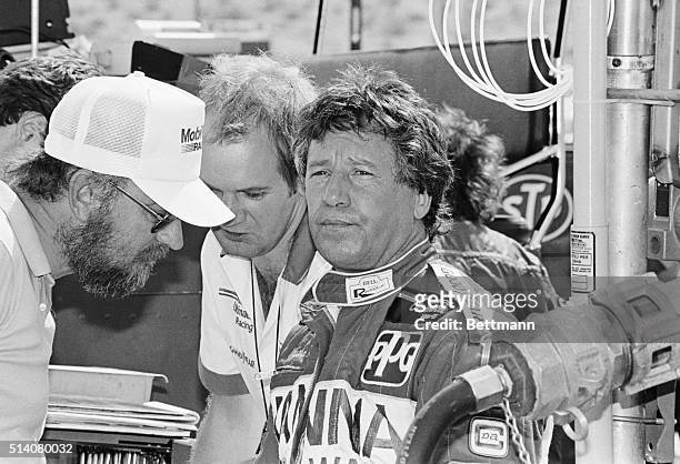 Indy car driver Mario Andretti takes a break in the pits before qualifying for the Phoenix 200 at Phoenix International Raceway. Andretti took the...
