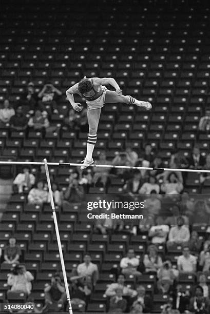 Soviet pole vaulter Sergei Bubka clears the pole at 5.85 meters in the pole vault competiton at the 1987 World Indoor Championships in Indianapolis,...