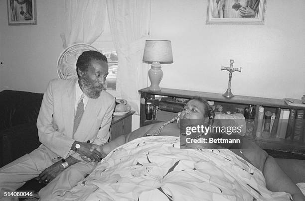 Walter Hudson, weighing 1,200 pounds, shakes hands with activist and comedian Dick Gregory. Gregory runs a weight-loss clinic and has put Hudson on a...