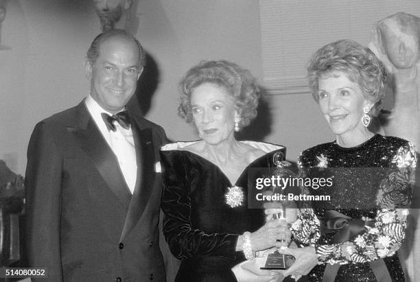 First Lady Nancy Reagan presents a special award to Mrs. Vincent Astor at the Council of Fashion Designers of America Awards. Designer Oscar De La...