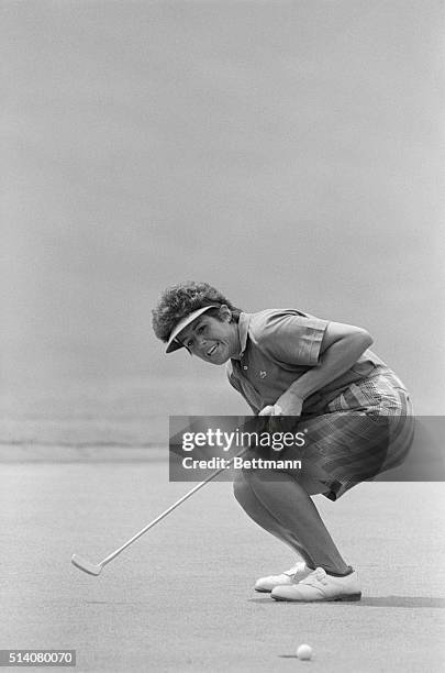 Golfer Nancy Lopez crouches down after missing a birdie putt by less than an inch on the green on the 8th hole at the LPGA tournament in Lake Lanier...