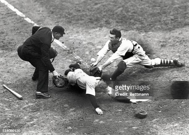 Joe Di Maggio slides safely home during game of the World Series.