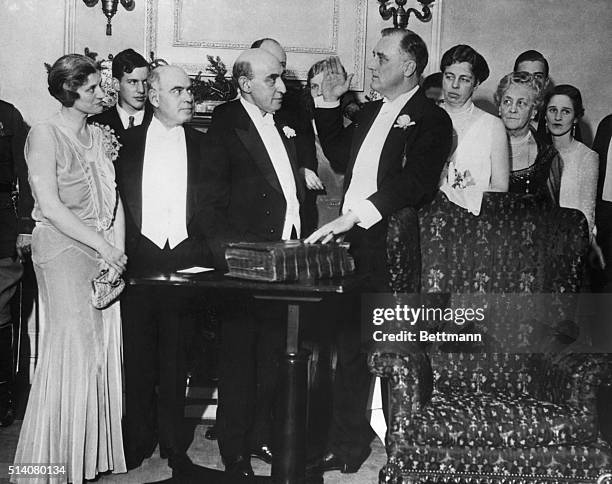 Franklin D. Roosevelt takes oath of office on family bible for second term as governor of New York.