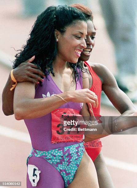 Florence Griffith-Joyner is congratulated by teammate Gail Devers after setting a new world record for the 100 meters at the U.S. Olympic Track and...