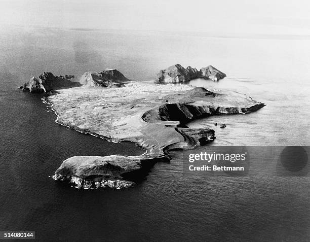 An aerial view of Iceland's Heimaey Island. The rounded dome on the flat part of the island is Helgafell, which erupted in 1973.