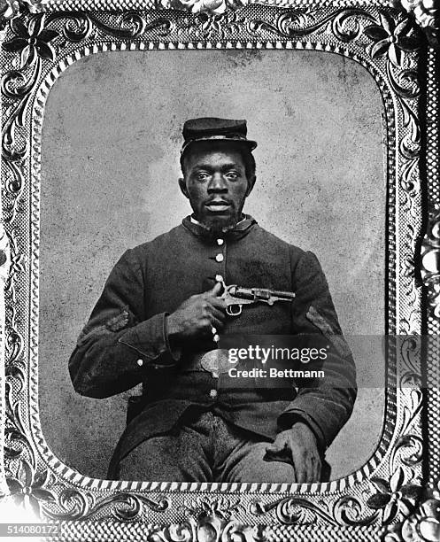 Negro Union Infantry corporal holds an 1849 Colt pocket revolver during the Civil War.