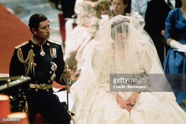 London, England-ORIGINAL CAPTION READS: Photo of Prince Charles and Lady Diana Spencer, shown seated during their wedding ceremony. BPA2# 6056