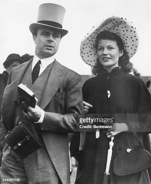 Epsom Downs, England: Newlyweds Rita Hayworth and Prince Aly Khan attend the 170th running of the English Derby at Epsom Downs, June 4. They saw...