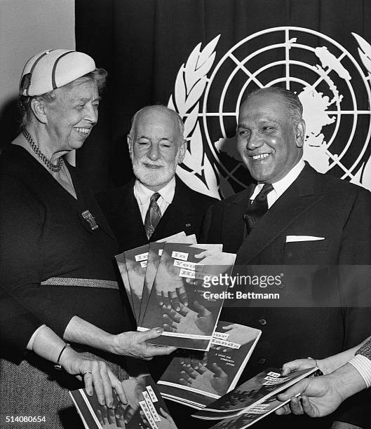 In special ceremonies at the United Nations today, Eleanor Roosevelt presents first copies of a publication In Your Hands, a guidebook of the US...