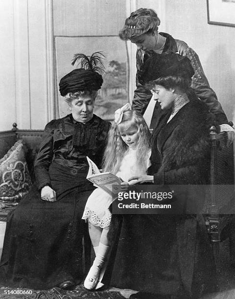 Eleanor Roosevelt looks over her daughter Anna, seated between Eleanor's grandmother Mary Hall and her aunt Elizabeth Livingston Mortimer.