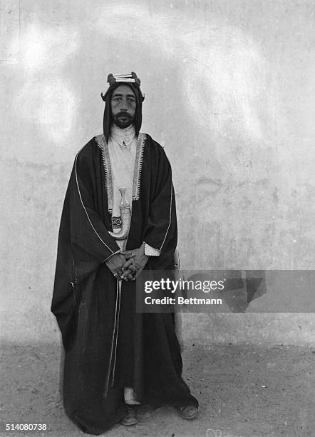 Faisal I , installed as King of Iraq by the British and became a leader of Arab Nationalism. Full-length portrait of Faisal I in typical garb common...