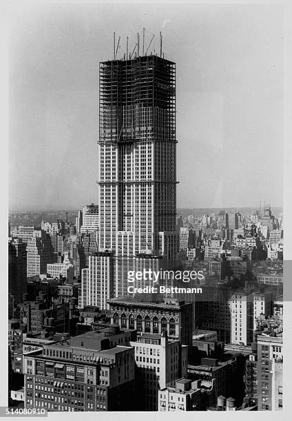 New York, NY-ORIGINAL CAPTION READS: Aerial photo of the Empire State Building under construction. Photograph ca. 1930.