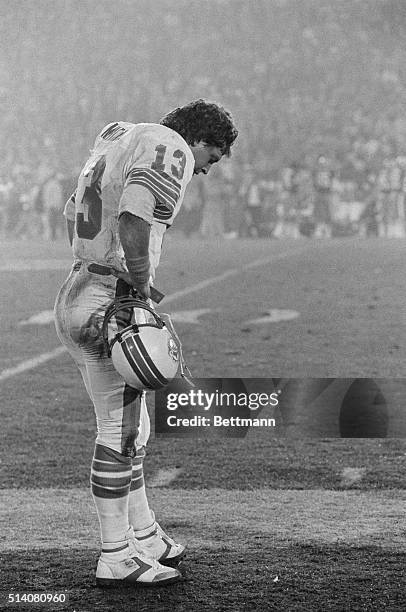 Miami Dolphins quarterback Dan Marino stands with his head down on the sidelines as his team goes down to defeat against the San Francisco 49ers in...