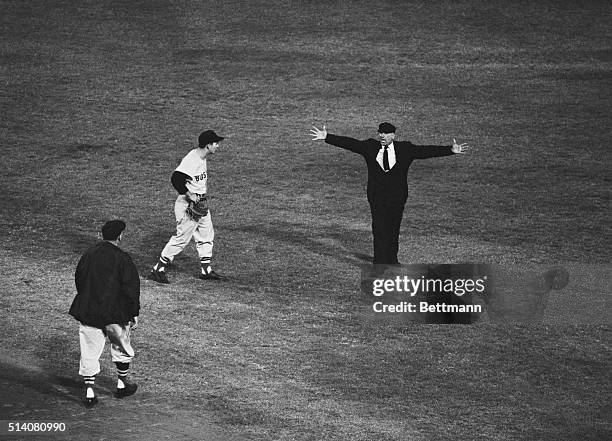 Los Angeles: Boston Red Sox shortstop Don Buddin throws to first as Los Angeles Angels Albie Pearson slides in. Umpire Larry Napp calls him safe...