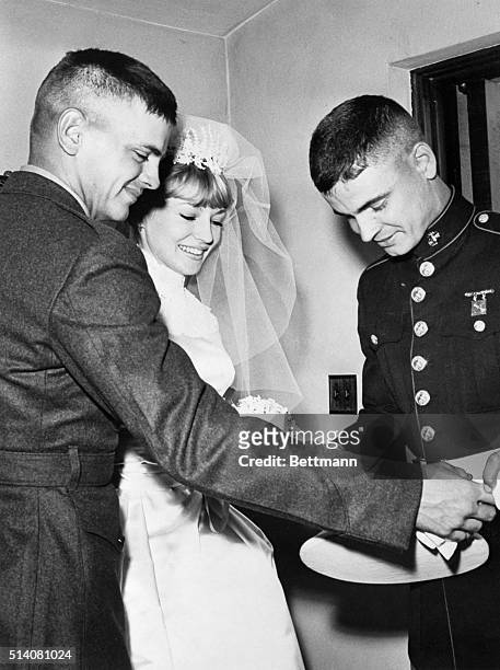 San Diego, California: Phil Everly, left, congratulates brother Don who married screen star Venitia Stevenson at North Chapel at the Naval Training...