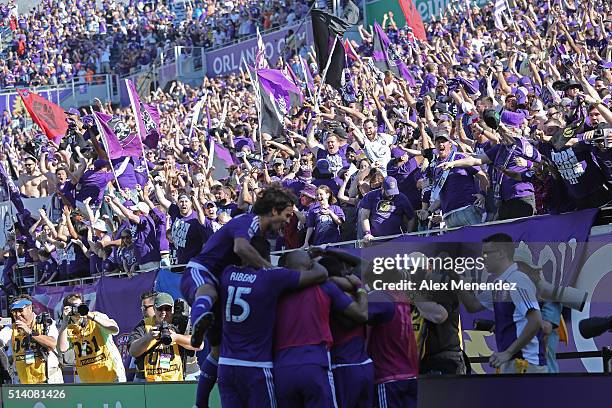 Teammates celebrate with Adrian Winter of Orlando City SC after his game tying goal in overtime during a MLS soccer match between Real Salt Lake and...