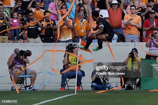 Giles Barnes of Houston Dynamo kicks the corner flag after scoring against the New England Revolution in the second half at BBVA Compass Stadium on...