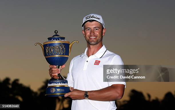 Adam Scott of Australia proudly holds the trophy after his one shot win in the final round of the 2016 World Golf Championship Cadillac Championship...