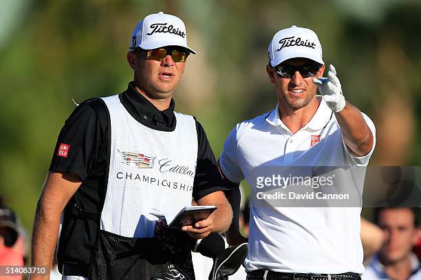 Adam Scott of Australia with his caddie David Clark on the tee at the par 4, 14th hole during the final round of the World Golf...