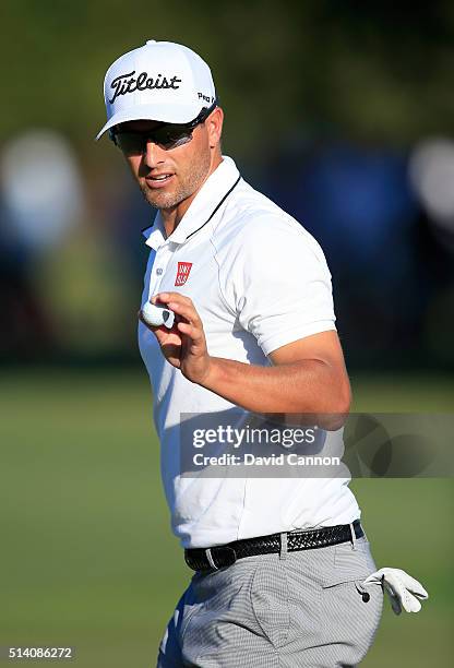 Adam Scott of Australia makes a par at the par 3, 13h hole during the final round of the 2016 World Golf Championship Cadillac Championship on the...