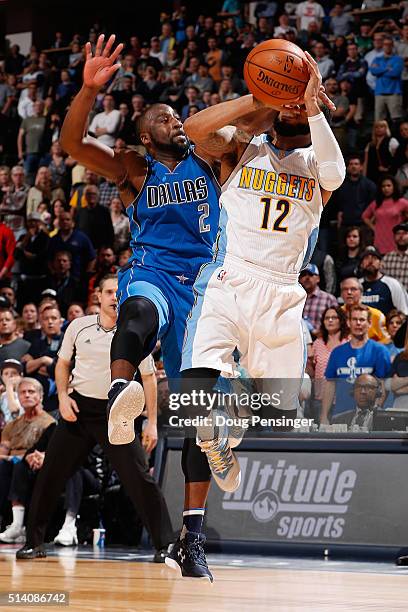 Augustin of the Denver Nuggets is fouled by Raymond Felton of the Dallas Mavericks with .9 seconds remaining in overtime at Pepsi Center on March 6,...